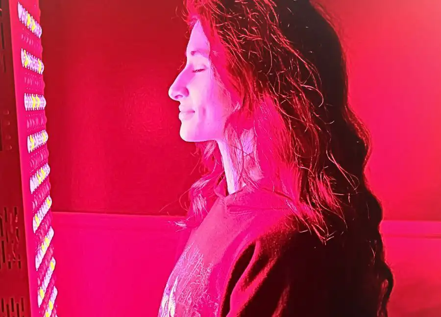 Woman receiving facial Red Light Therapy